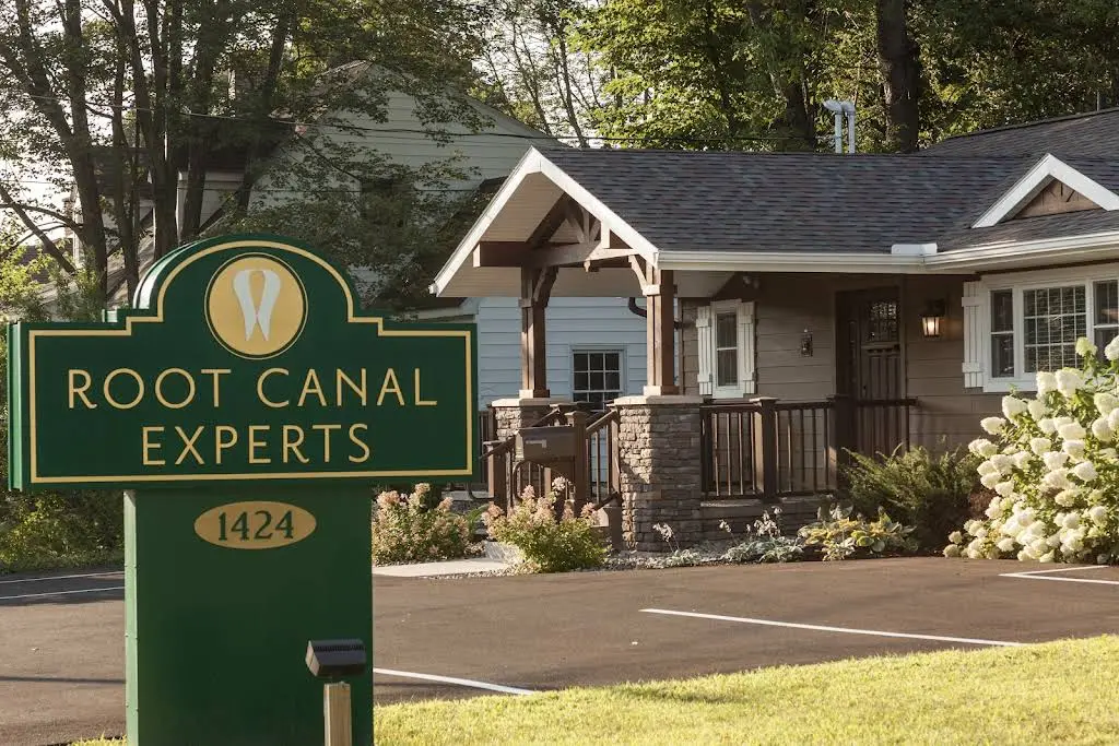 Root Canal Experts - Professional dental clinic exterior with modern facilities