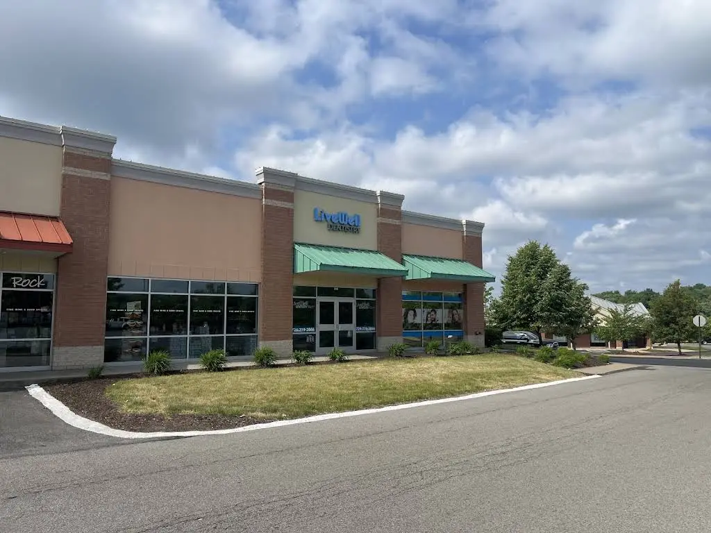 LiveWell Dental Care - Professional dental clinic exterior with modern facilities