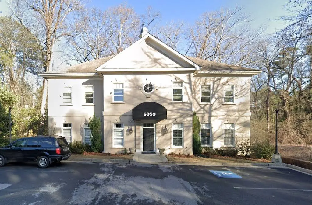 Dr. Meredith Hughes & Dr. J. Sedgie Newsom - Professional dental clinic exterior with modern facilities