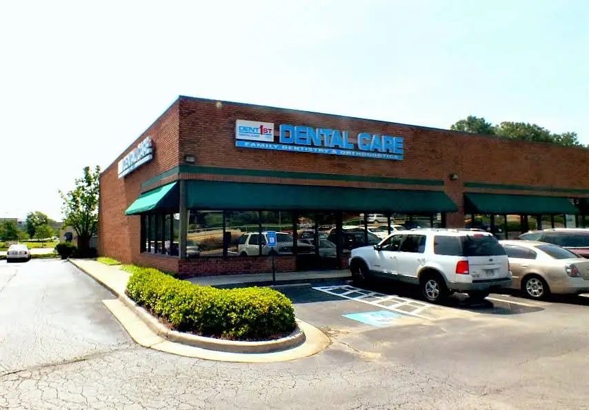 DentFirst Dental Care - Professional dental clinic exterior with modern facilities