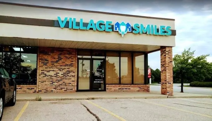 Village Smiles - Professional dental clinic exterior with modern facilities