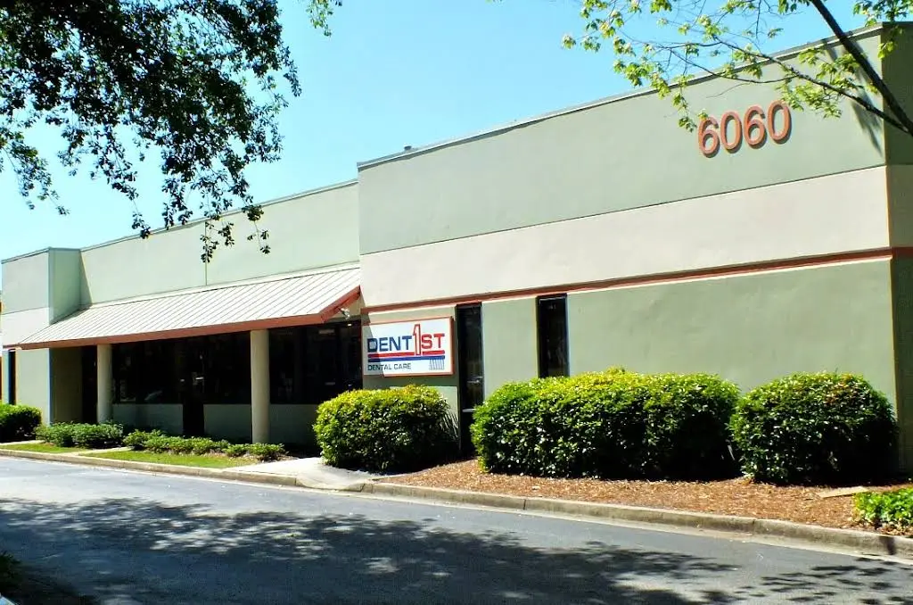 DentFirst Dental Care - Professional dental clinic exterior with modern facilities