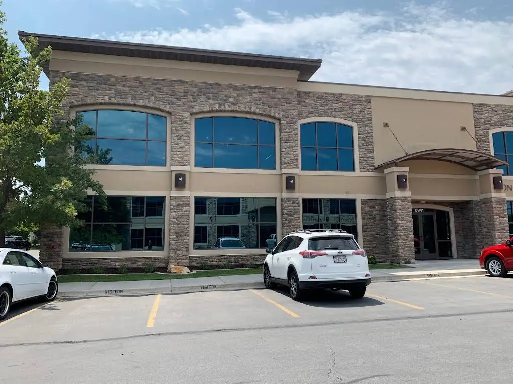 Sandy Center Family and Cosmetic Dentistry - Professional dental clinic exterior with modern facilities