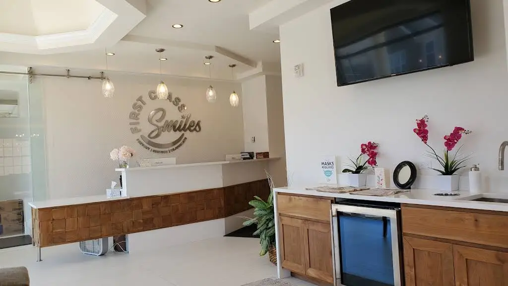 First Class Smiles - Professional dental clinic exterior with modern facilities