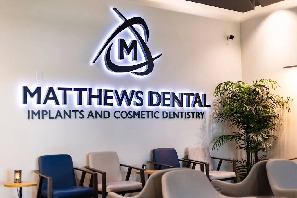 Matthews Implant & Cosmetic Dentistry - Professional dental clinic exterior with modern facilities