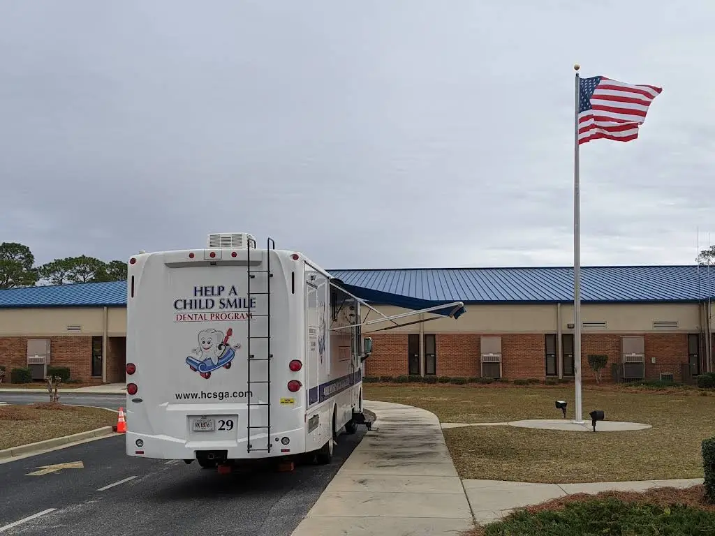 Help A Child Smile - Professional dental clinic exterior with modern facilities