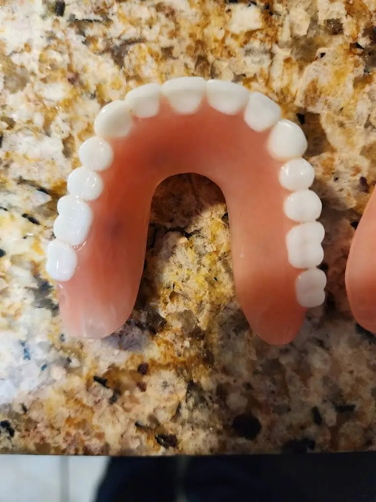 Affordable Dentures & Implants - Professional dental clinic exterior with modern facilities