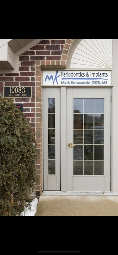 MK Periodontics and Implants - Professional dental clinic exterior with modern facilities