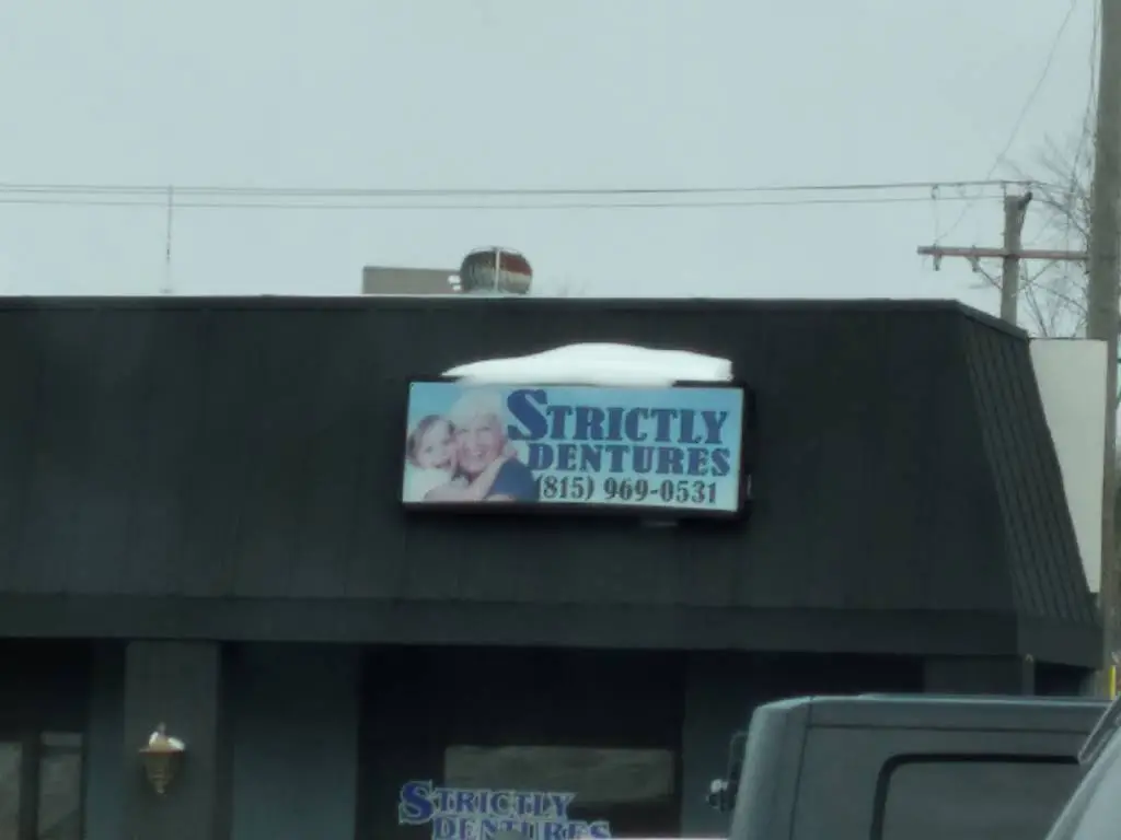 Strictly Dentures & Dental - Professional dental clinic exterior with modern facilities