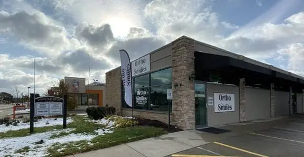 Ortho Smiles - Professional dental clinic exterior with modern facilities