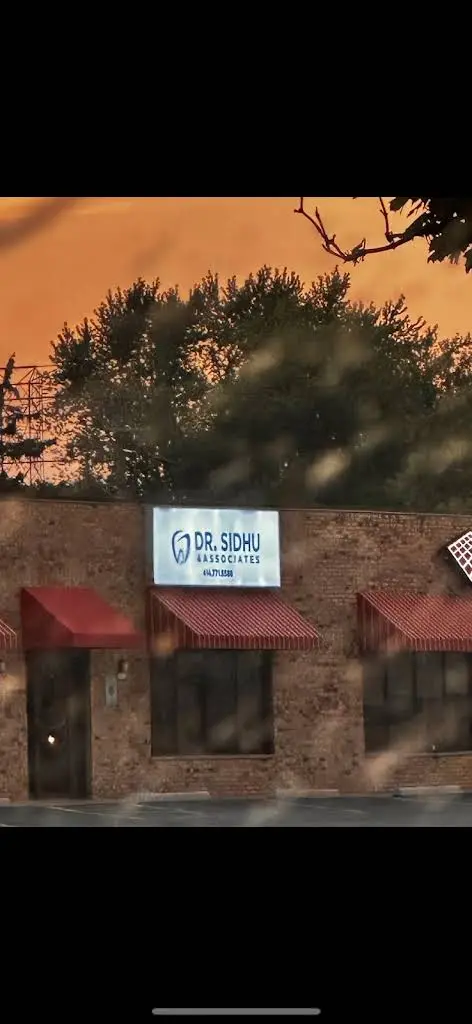 Dr. Sidhu & Associates - Professional dental clinic exterior with modern facilities