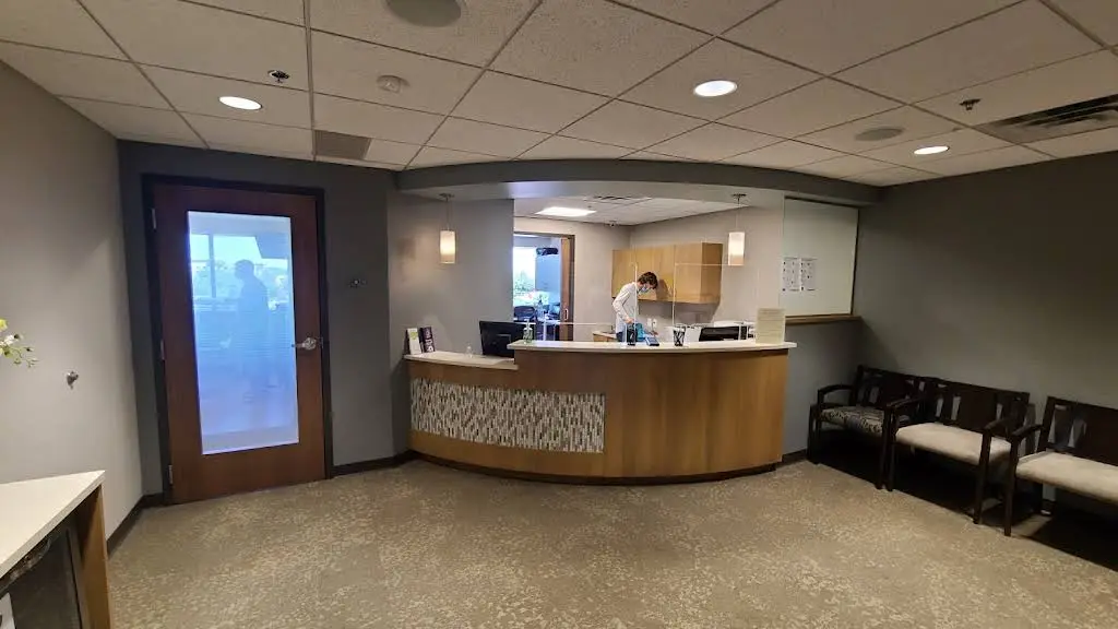 EOS: Expert Oral Surgery & Dental Implants - Professional dental clinic exterior with modern facilities