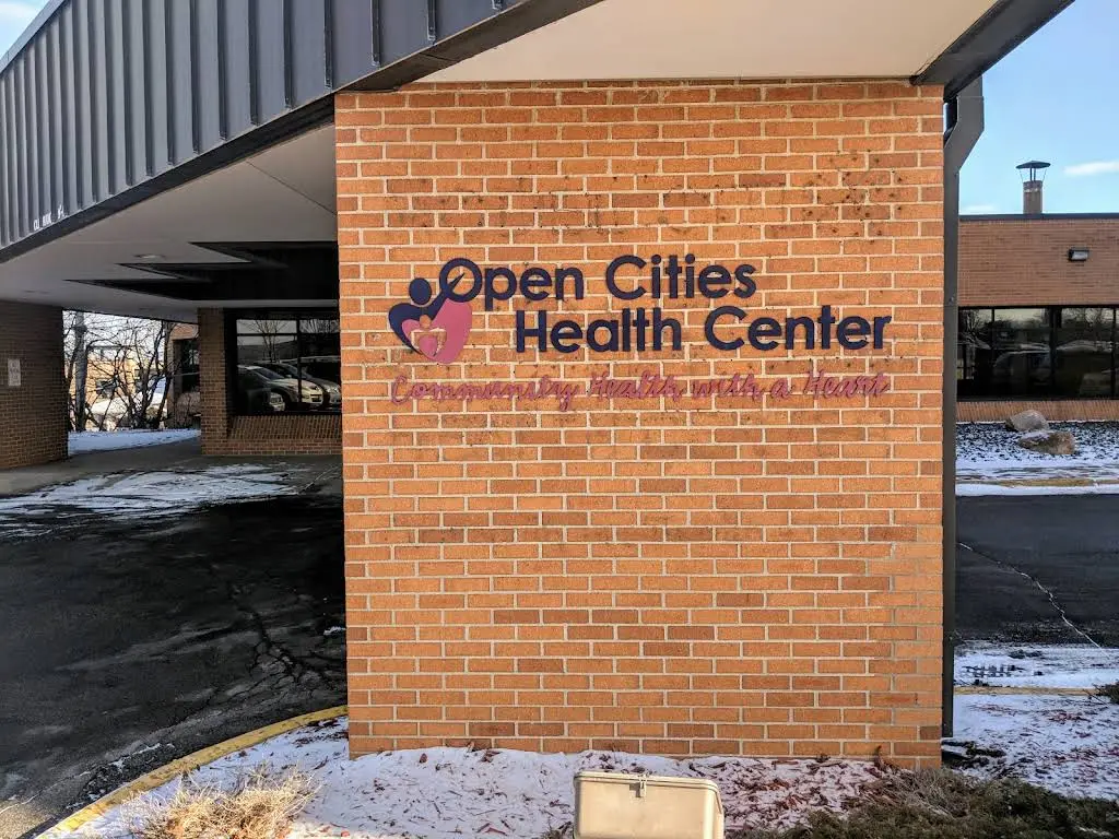 Open Cities Health Center - Professional dental clinic exterior with modern facilities