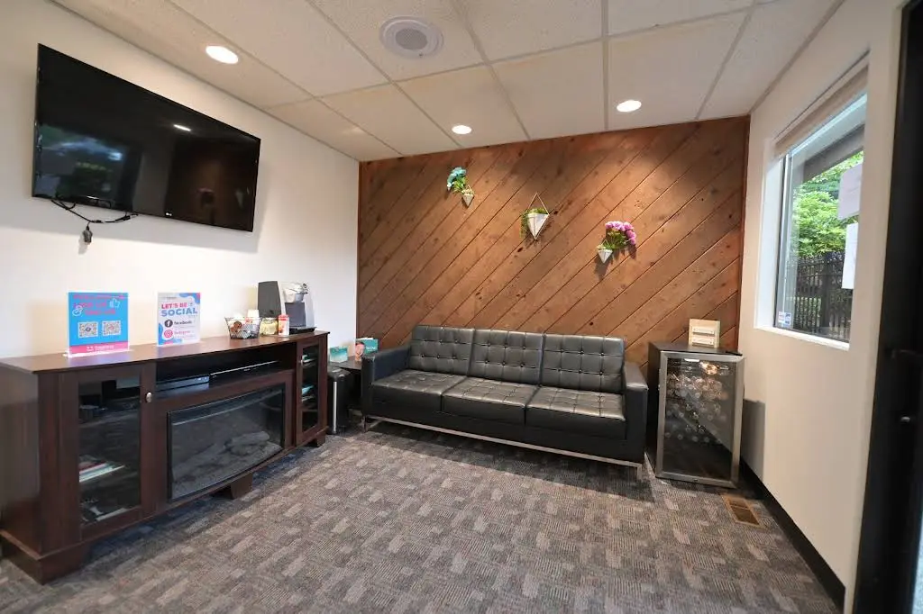 Freelove Orthodontics & Smile Design - Professional dental clinic exterior with modern facilities