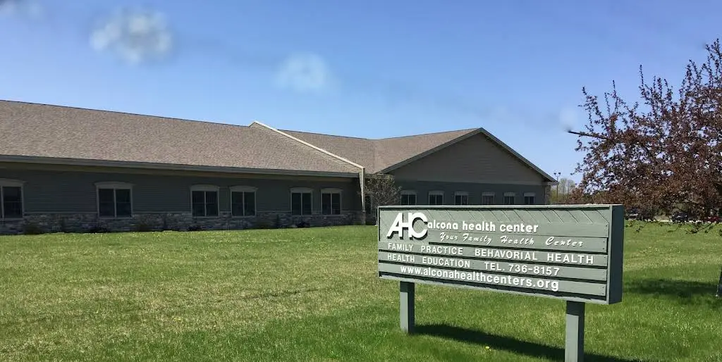 Alcona Health Center - Professional dental clinic exterior with modern facilities