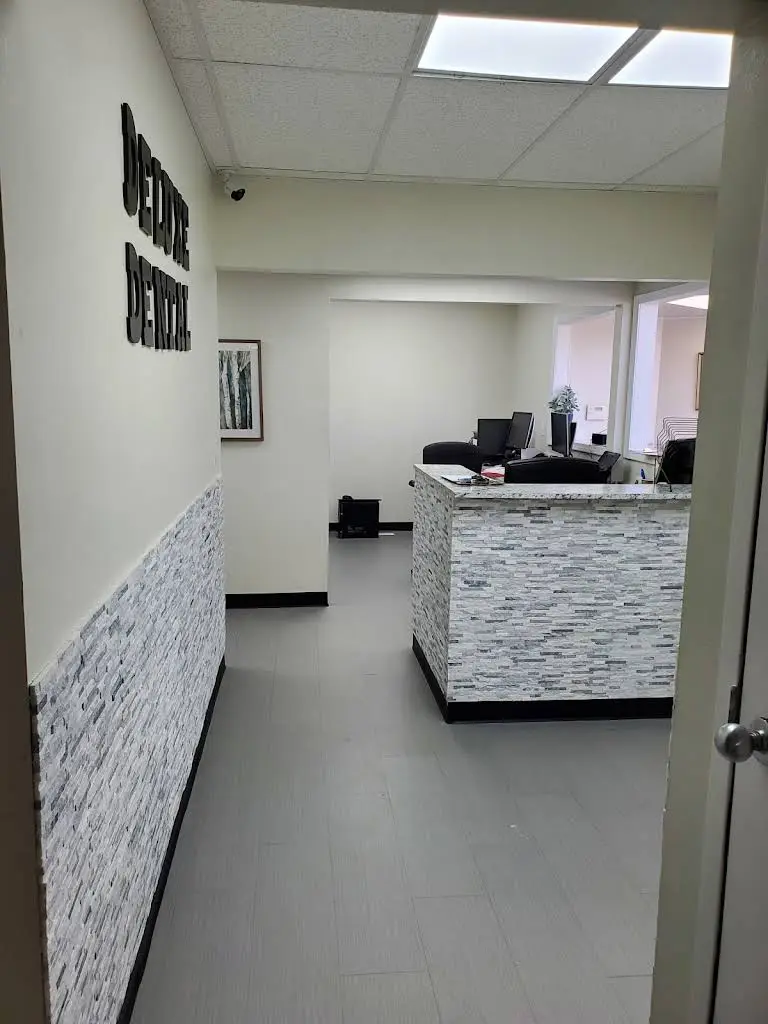 Deluxe Dental Mount Morris - Professional dental clinic exterior with modern facilities