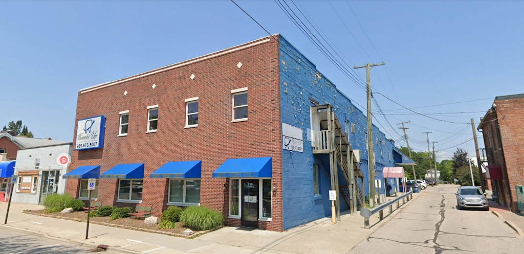 Thumbs Up Dental - Caro - Professional dental clinic exterior with modern facilities