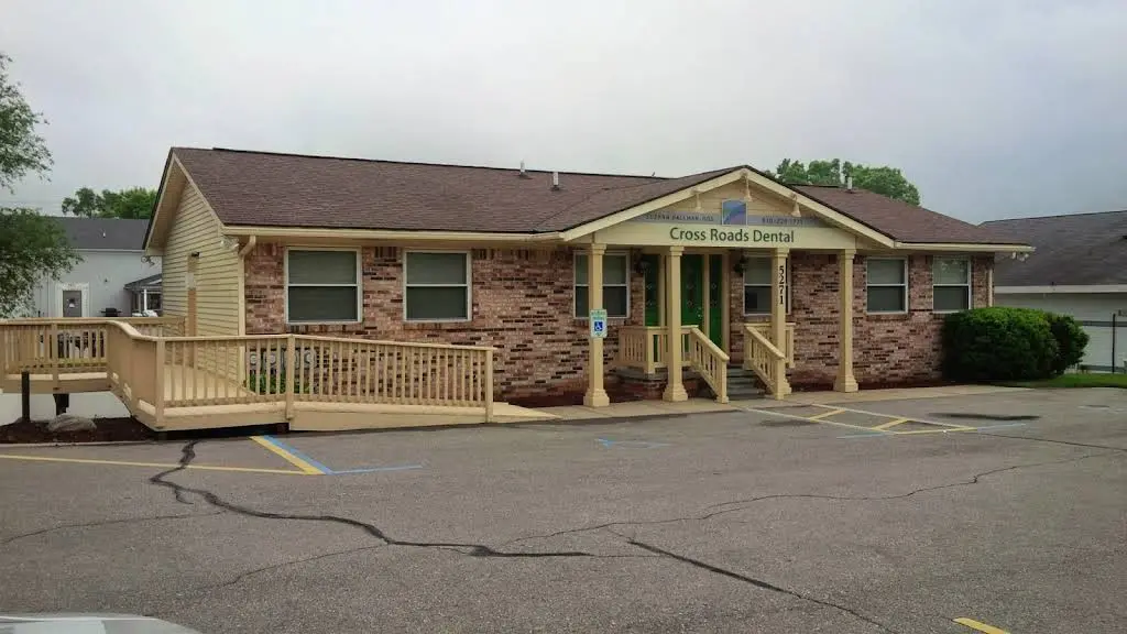 Cross Roads Dental / Suzann Hallman DDS PC - Professional dental clinic exterior with modern facilities