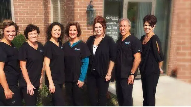 John R. Striebel, DDS - Professional dental clinic exterior with modern facilities