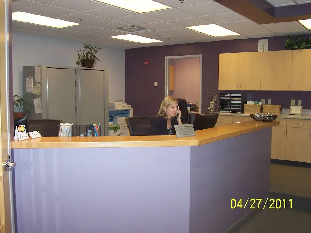 Dr. Lisa Mitchell DDS - Professional dental clinic exterior with modern facilities