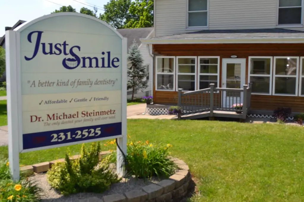 Just Smile - Professional dental clinic exterior with modern facilities