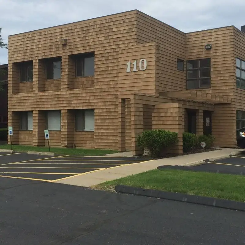 Dental Health Services - Professional dental clinic exterior with modern facilities