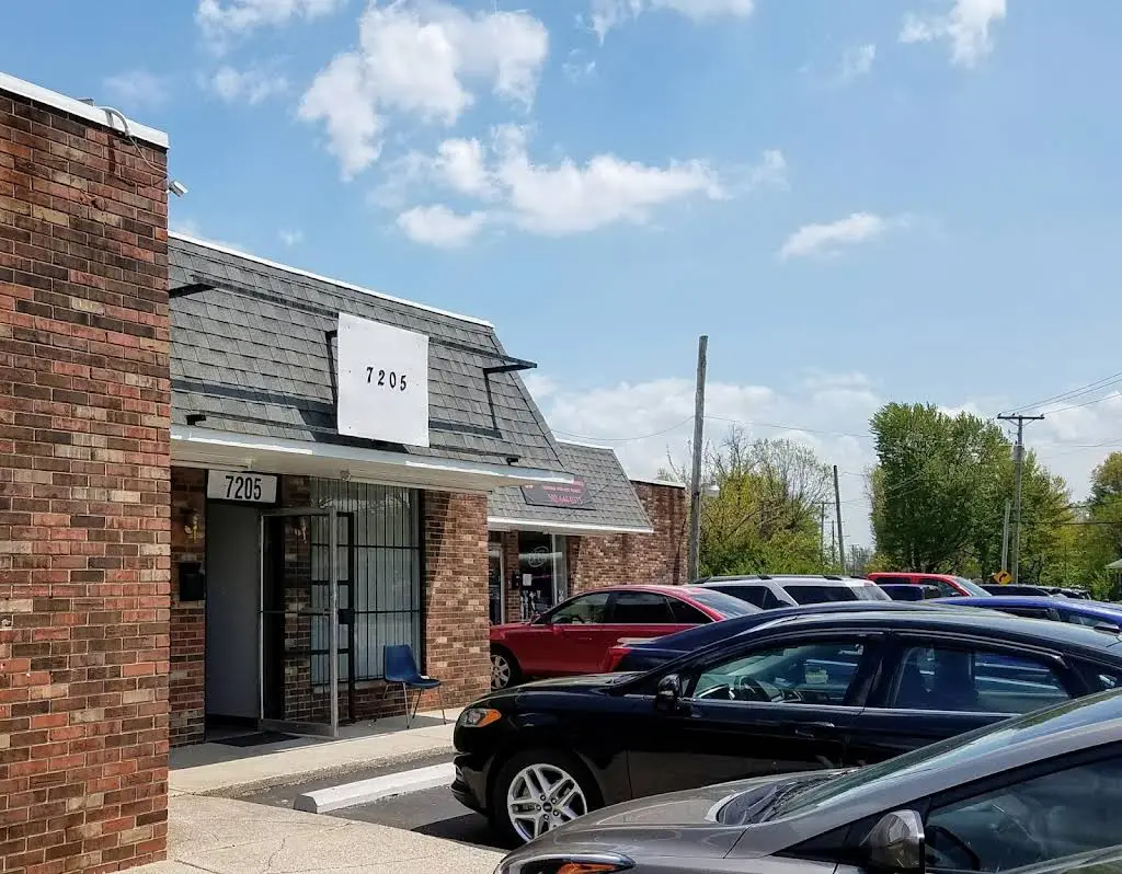Quality Dentures - Professional dental clinic exterior with modern facilities
