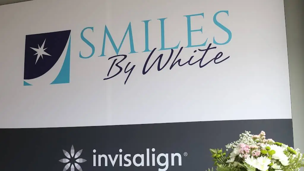 Smiles By White - Professional dental clinic exterior with modern facilities
