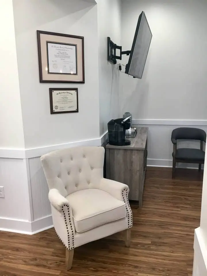 Acharya Periodontics & Dental Implants - Professional dental clinic exterior with modern facilities