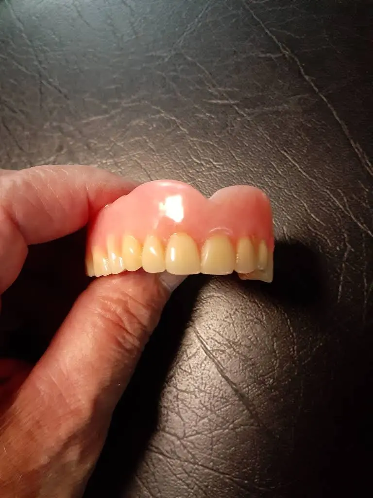 Affordable Dentures & Implants - Professional dental clinic exterior with modern facilities