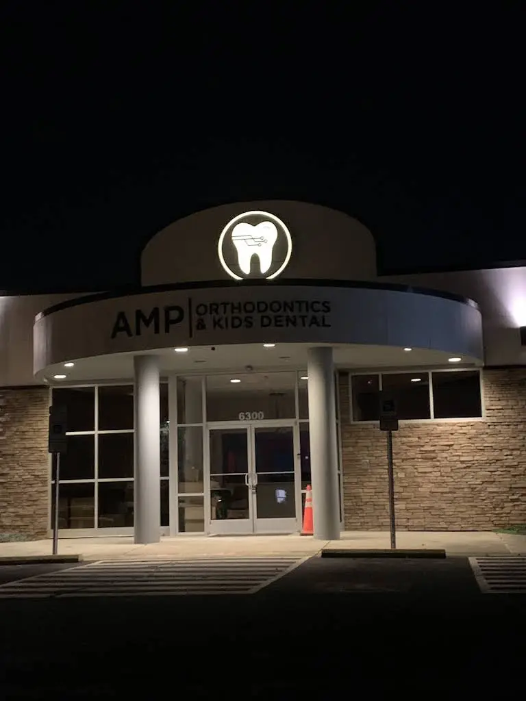 Amp Orthodontics & Kids Dental - Professional dental clinic exterior with modern facilities