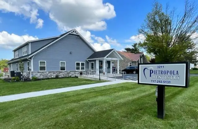 Pietropola and Associates Family and Cosmetic Dentistry - Professional dental clinic exterior with modern facilities