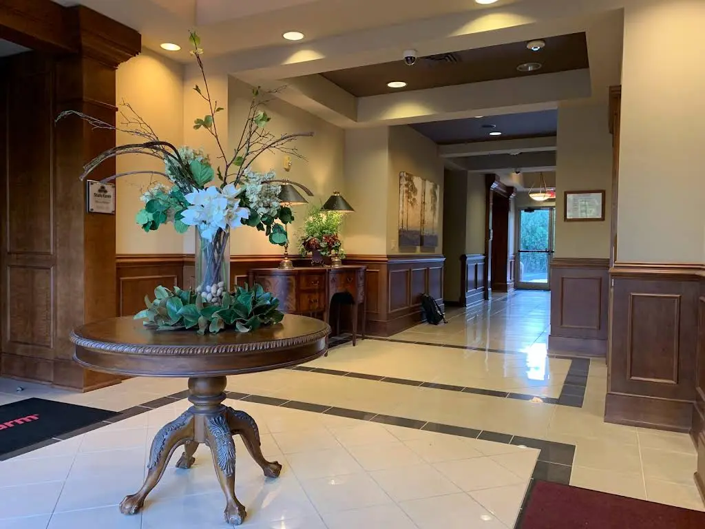 Caring Smile Dentistry & Implant - Professional dental clinic exterior with modern facilities