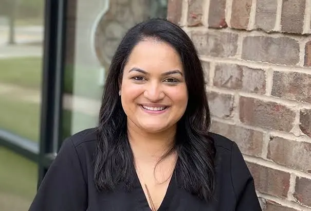 Reflections Dental: Dr. Kavita Suthar, DDS - Professional dental clinic exterior with modern facilities