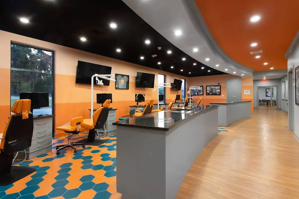 North Carolina Oral Surgery + Orthodontics - Professional dental clinic exterior with modern facilities