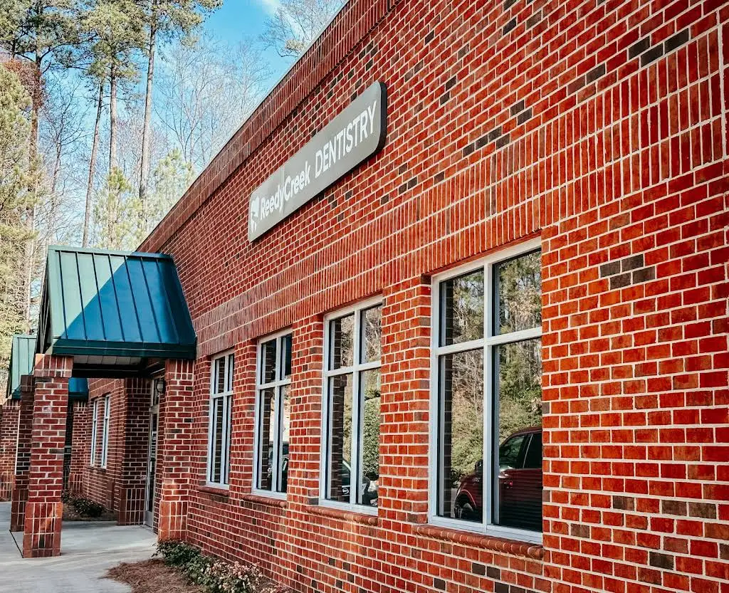 Reedy Creek Family & Cosmetic Dentistry: Emily Reece, DMD - Professional dental clinic exterior with modern facilities
