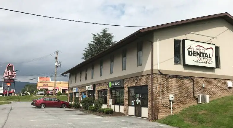 American Dental Solutions - Professional dental clinic exterior with modern facilities