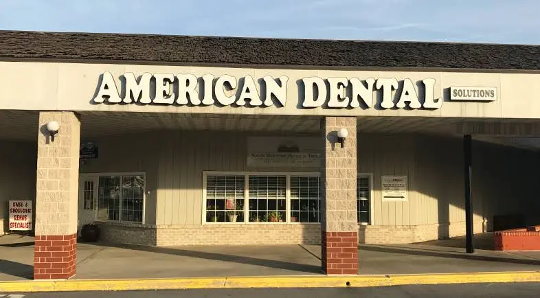 American Dental Solutions - Professional dental clinic exterior with modern facilities