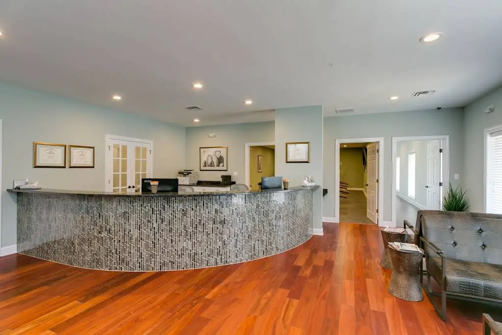 North Carolina Oral Surgery + Orthodontics - Professional dental clinic exterior with modern facilities