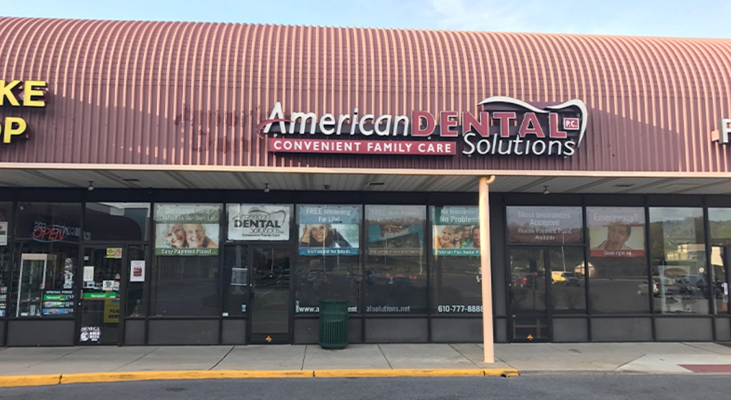 American Dental Solutions - Professional dental clinic exterior with modern facilities