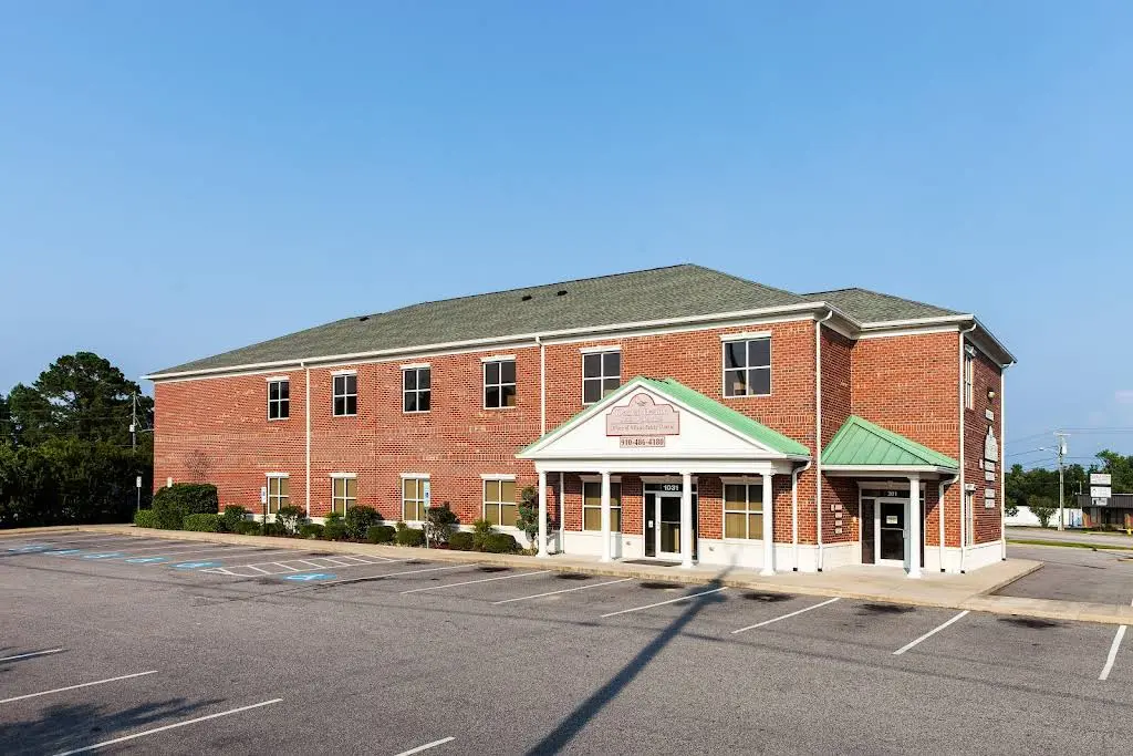 Village Family Dental - Professional dental clinic exterior with modern facilities