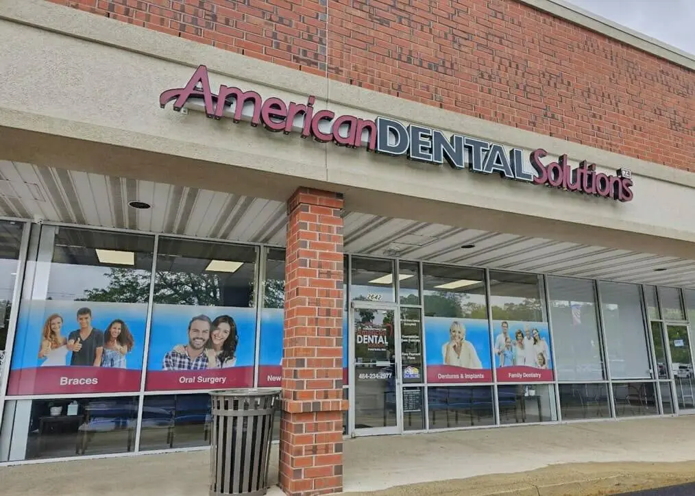 American Dental Solutions - Professional dental clinic exterior with modern facilities