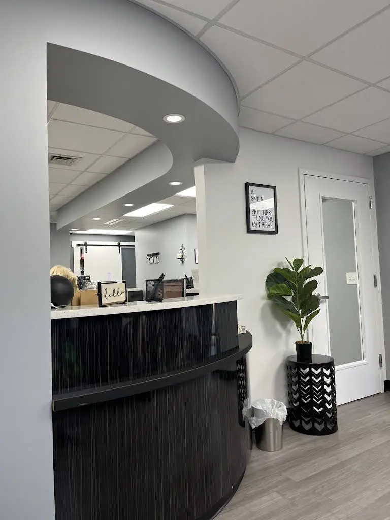 Family Smile Care: Woodmancy Helene A DMD - Professional dental clinic exterior with modern facilities