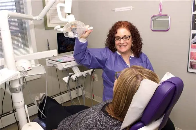 Kathleen Sauchelli, DMD - Professional dental clinic exterior with modern facilities