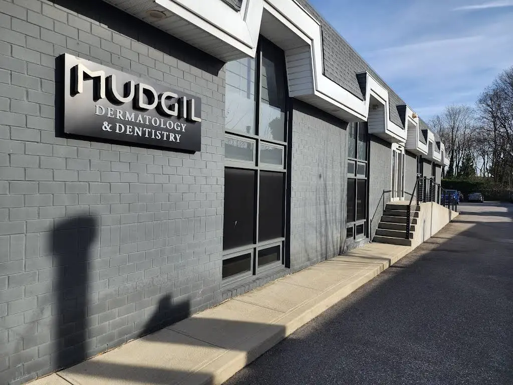 Mudgil Periodontics and Implant Dentistry - Professional dental clinic exterior with modern facilities