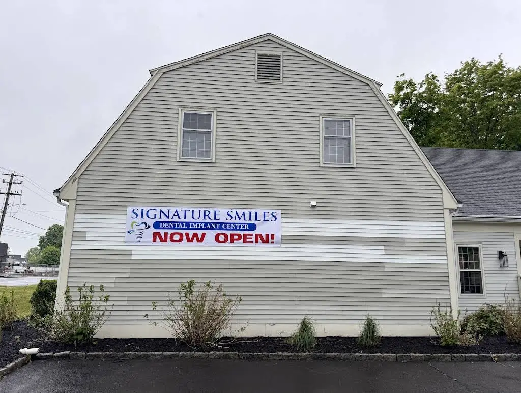 Signature Smiles Dental Implants and Cosmetic Dentistry - Professional dental clinic exterior with modern facilities