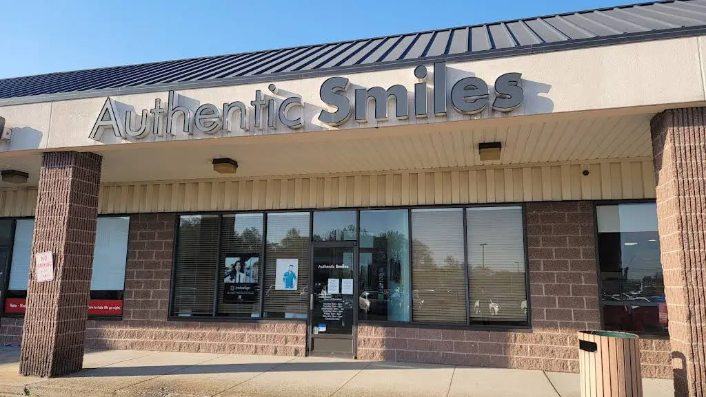 Authentic Smiles - Professional dental clinic exterior with modern facilities