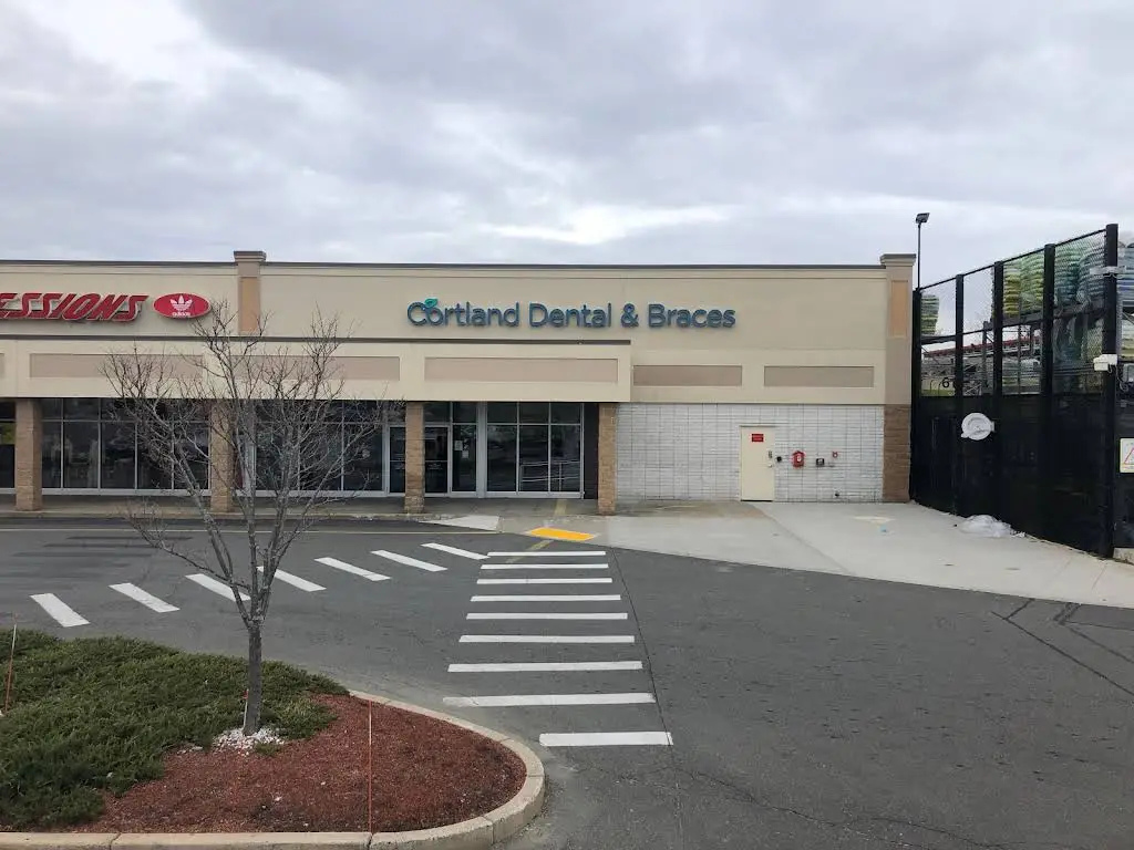 Cortland Dental & Braces - Professional dental clinic exterior with modern facilities