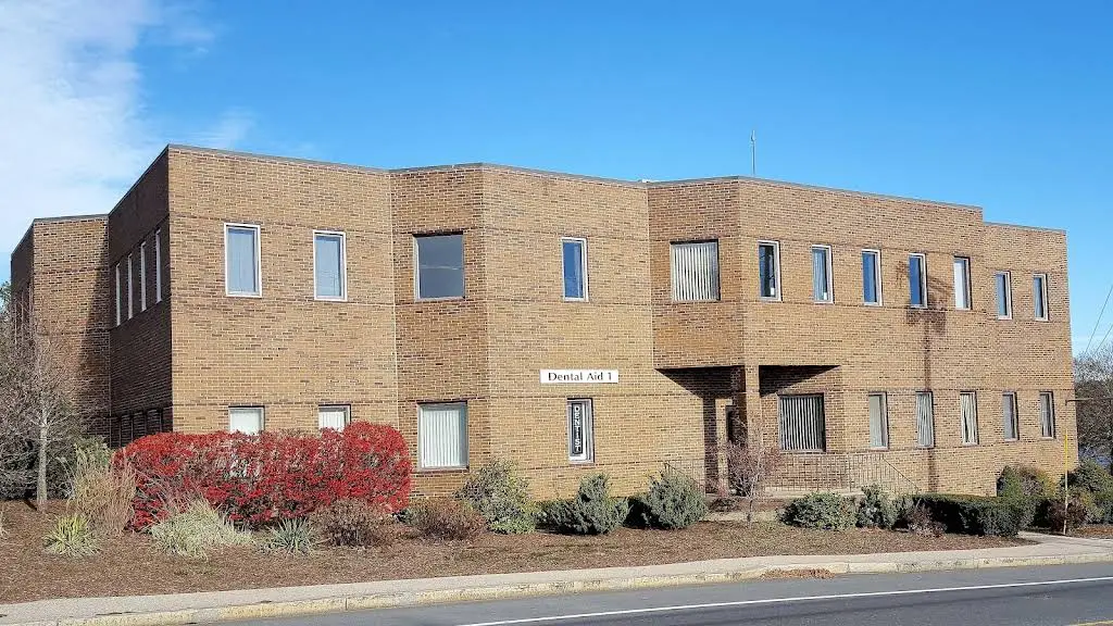 Dental Aid 1 - Professional dental clinic exterior with modern facilities
