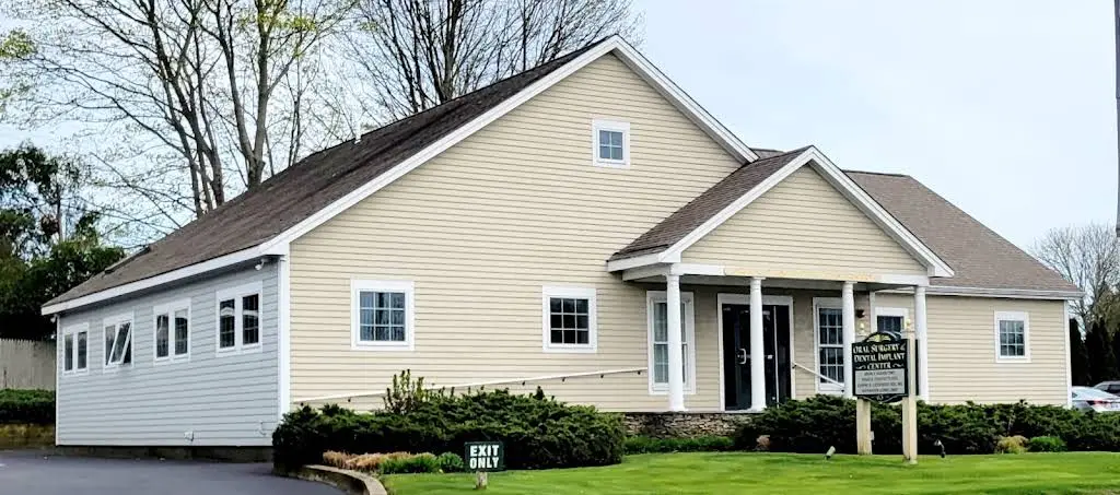 Oral Surgery & Dental Implant Center - Professional dental clinic exterior with modern facilities